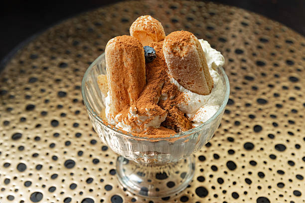istock Classic tiramisu dessert in glass cup. 2213559223