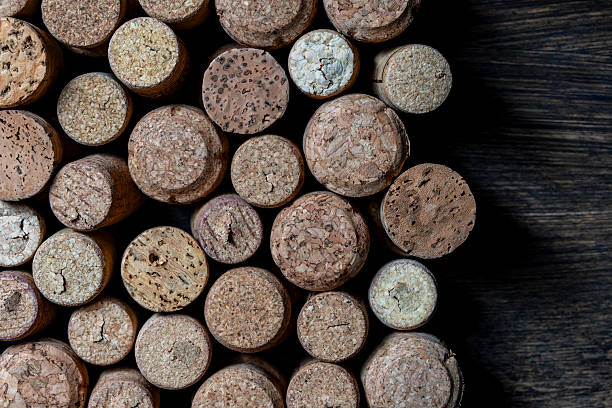istock Used wine corks on wooden table, top view, closeup, copy space 2213561321