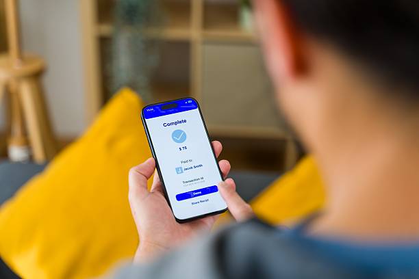 istock Young Adult Checking Mobile Payment Status 2213561832