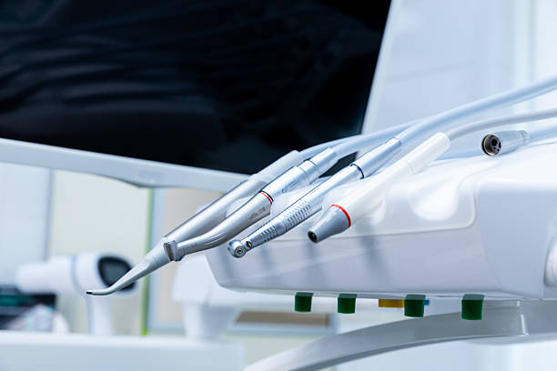 istock Advanced Dental Equipment with Multiple Handpieces and Connectors on a Clean and Modern Dental Chair in a Bright Clinic Setting Focused on Oral Health and Patient Care 2213562061