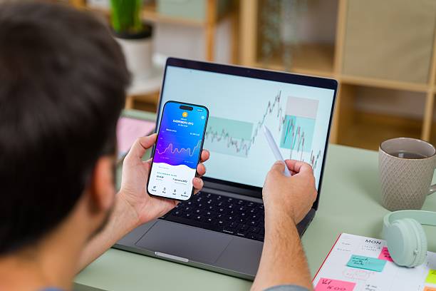 istock Analyzing Cryptocurrency Trends on Smartphone and Laptop 2213563476