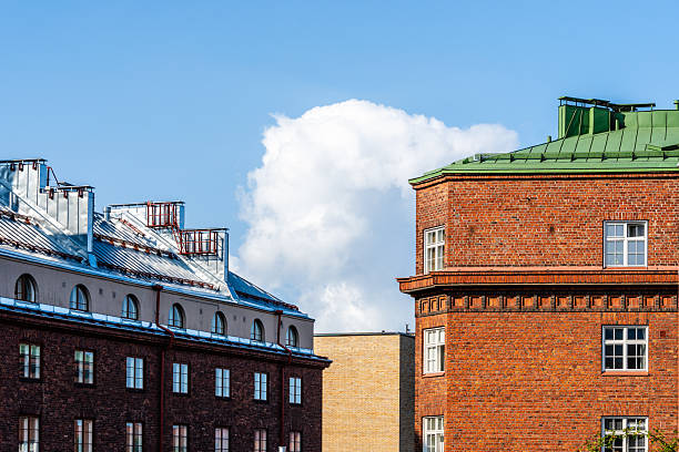 istock A charming Helsinki scene features a red brick building against a vibrant blue sky. 2213564366