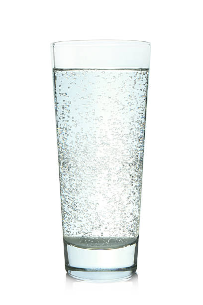 istock Refreshing soda water in glass on mirror surface isolated on white 2213567675