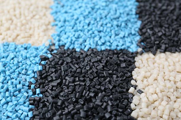 istock Pile of colorful plastic granules as background, closeup 2213567768