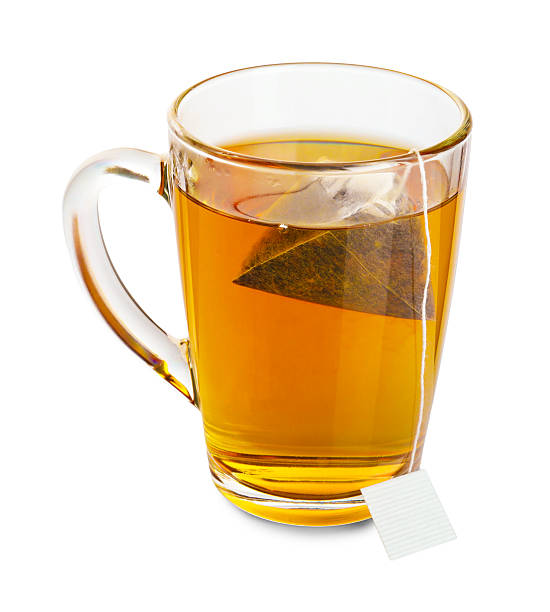 istock Tea bag in glass cup with hot drink isolated on white 2213568089