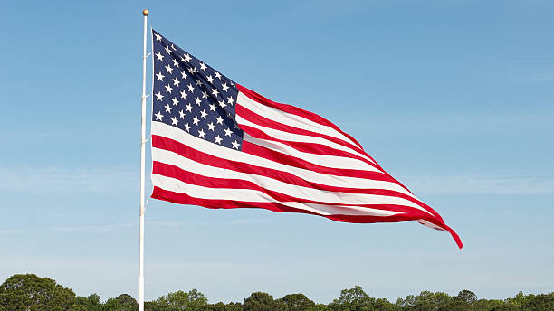 istock American Flag - Large 3,200 Square Foot Flag - 120 Foot Flagpole- Low Angle Medium Shot 2213568417