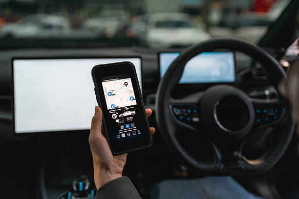 istock A woman exploring various features on the EV car's smart application through her smartphone 2213569394