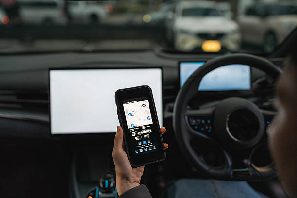 istock A woman exploring various features on the EV car's smart application through her smartphone 2213569411
