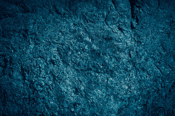 Dark turquoise or green wall background. Beautiful dark rock or stone texture. Abstract texture.