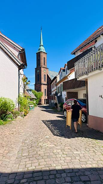 Dilsberg, Germany - 4/28/2025, Main Street and housed, in the background the Catholic Church.