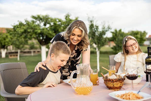istock Family Dinner Gathering in the Backyard 2213574184