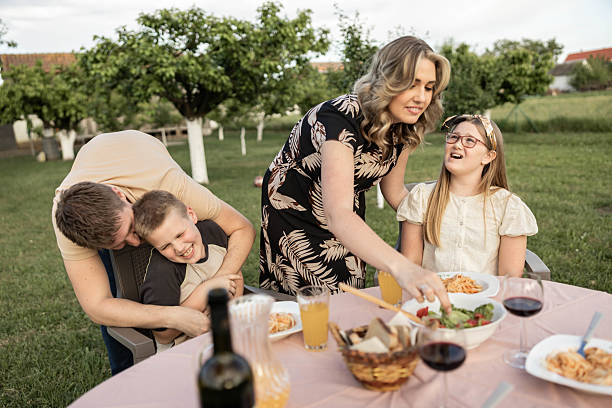 istock Family Gathering with Delicious Meals 2213574186