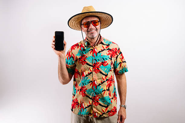 istock Mature tourist holding phone with blank screen 2213574281