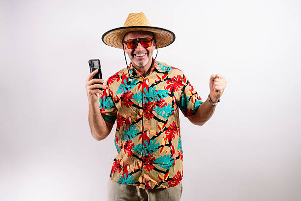 istock Excited man holding smartphone, celebrating success 2213574293