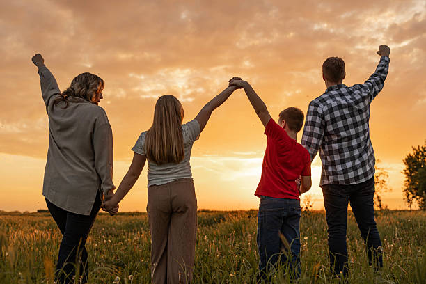 istock Family Celebrating Together at Sunset 2213574309