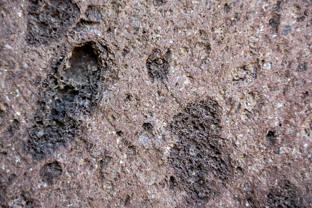Texture of stone with grooves used for building an ancient fortress