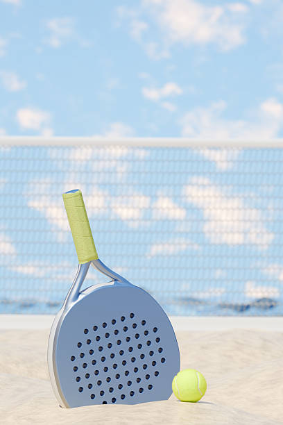 istock Paddle tennis racket and ball during a sunny outdoor match. 3d rendering 2213577857