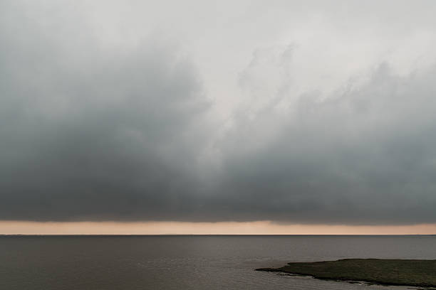 dramatic stormy sky on the horizon over an island