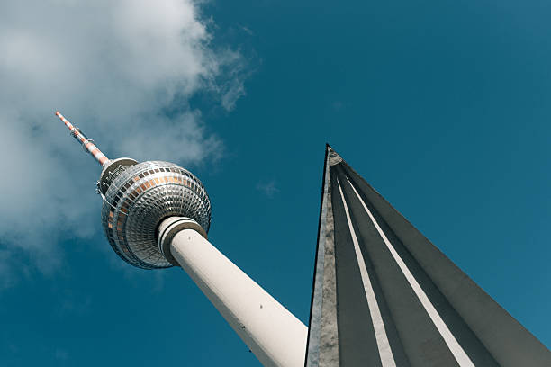 Berlin TV Tower viewed from below with blue sky