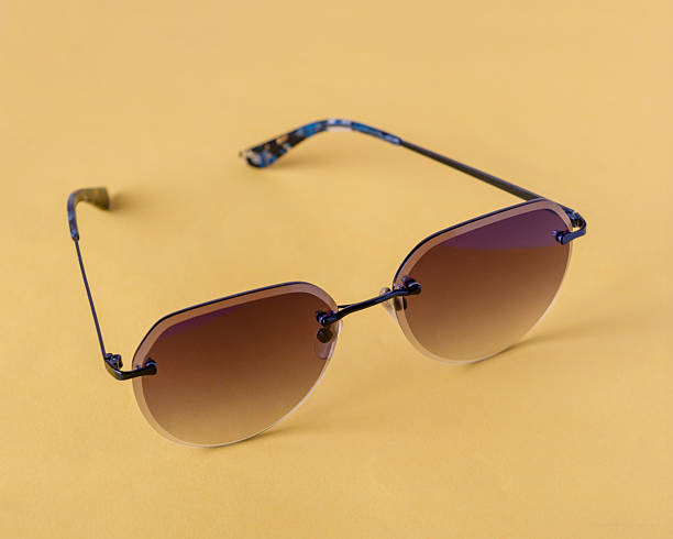 istock dark glasses with metal frame on yellow background 2213581462