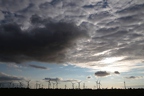 Windmills for electric power production at sunset in north germany