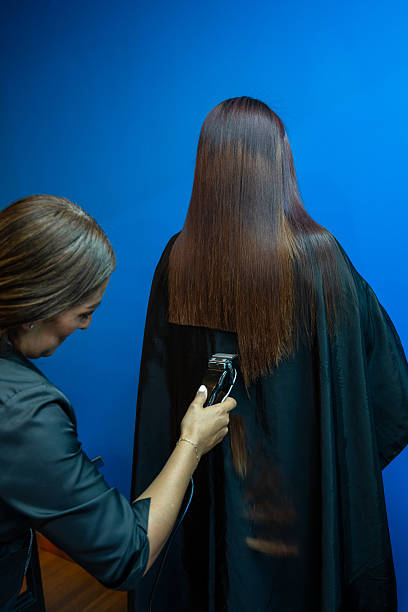 Beautiful wet long hair of a girl. Hair coloring in a beauty salon. Macro photography of women's hair. Concept of hair care. Beauty care concept.
