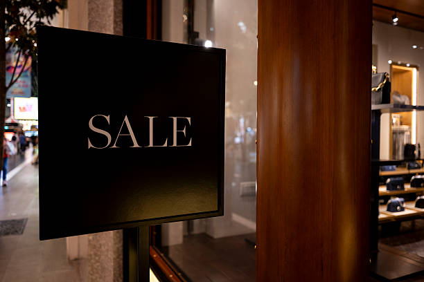 istock Sale Sign Displayed on Storefront Window 2213588505