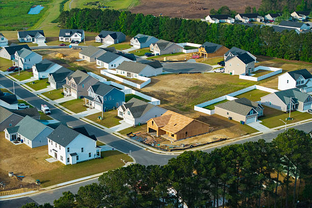 New Development Neighborhood - House Under Construction - Wide Shot