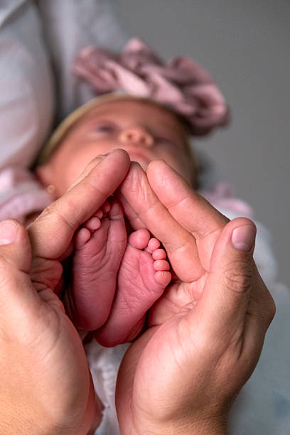 istock Baby girl's feet 2213595842