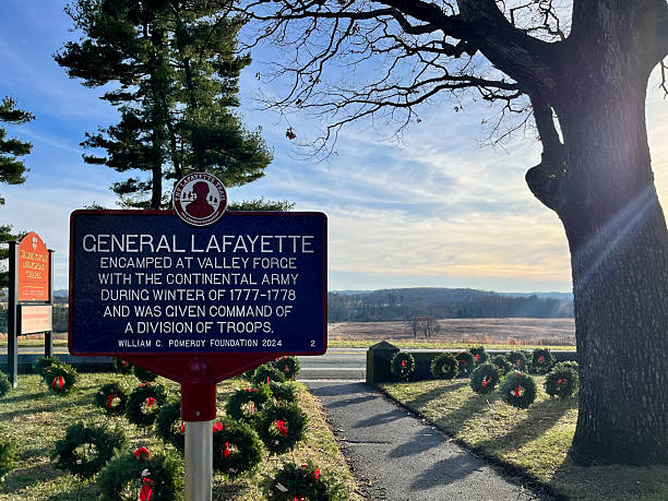 Philadelphia, PA. USA - Dec 17th 2024:  A sign that says General Lafayette is on a path. The sign is red and black. The sign is on a path with a tree behind it, Valley Forge Park
