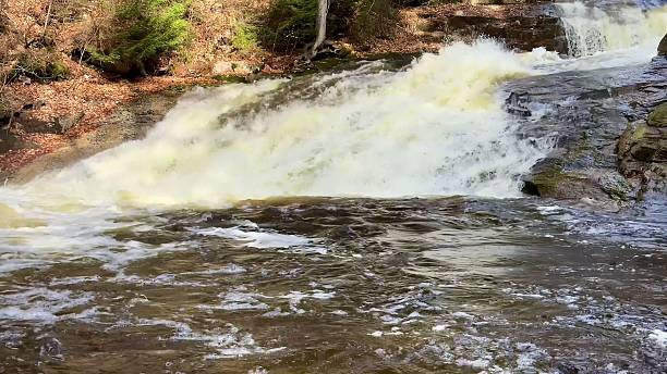istock A Beautiful Cascading Waterfall Surrounded by a Lush Green Forest that Invites Exploration 2213604475