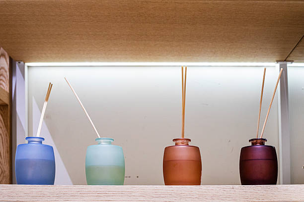 multicolored containers with sticks with different aromas and smells in the interior