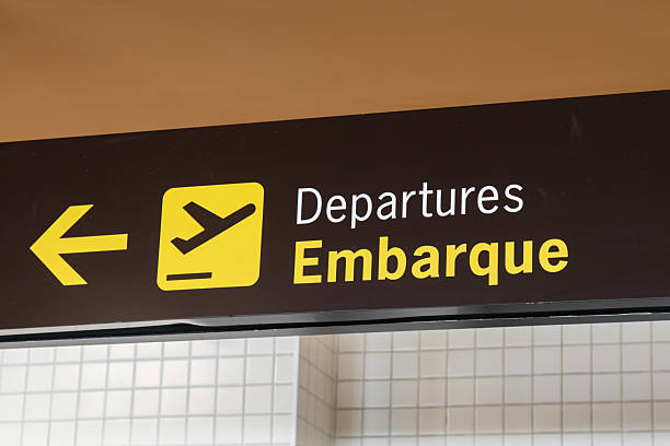 istock Airport sign indicating boarding. 2213613698