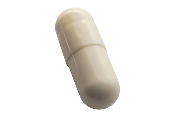istock White medicine pill capsule isolated on white background 2213615171