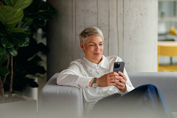 istock Relaxed Businesswoman Using Smartphone 2213615182