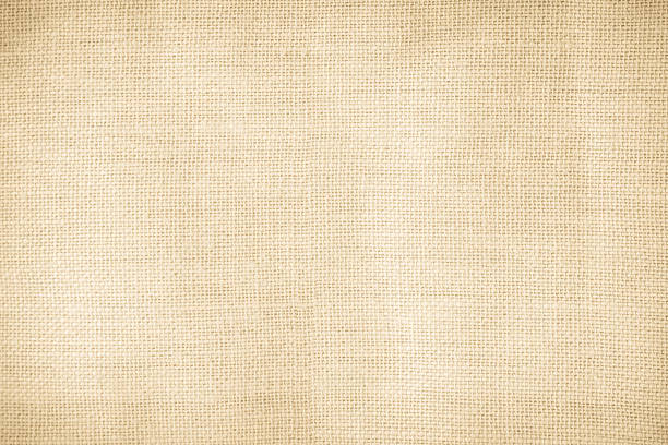 istock Brown sackcloth woven texture background in natural pattern. Jute hessian burlap, linen background in light beige cream color blank. Weaving canvas fiber line cotton cloth textured as organic. 2213615324