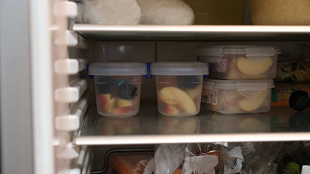 istock Chopped fruits in the plastic container are stored in refrigerator. 2213622026