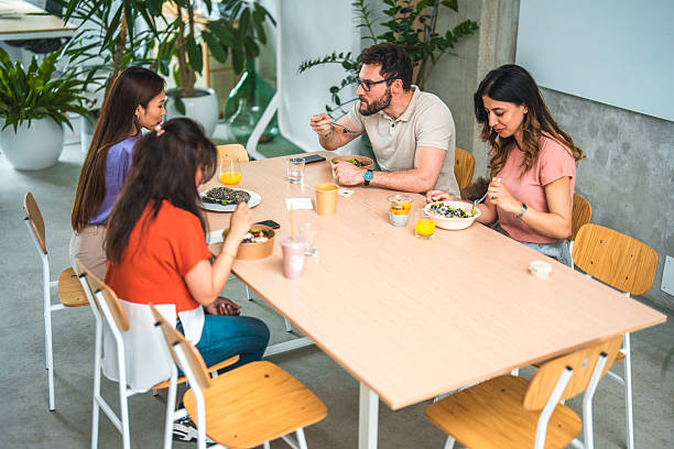 istock Modern Office Environment with Diverse Coworkers and Healthy Lunch 2213627222