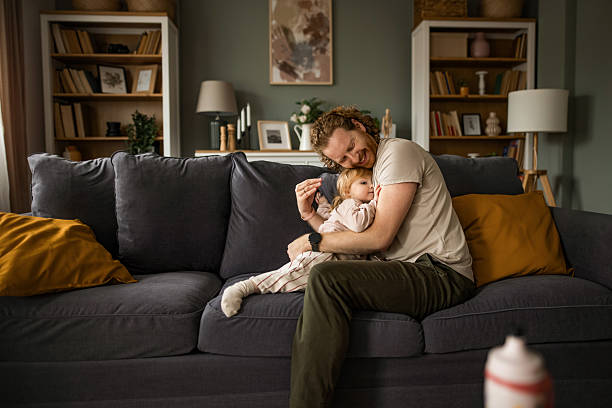 istock Father embracing his daughter at home 2213632244