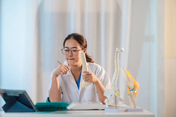 istock Asian Medical Student Studying Anatomical Model 2213635752