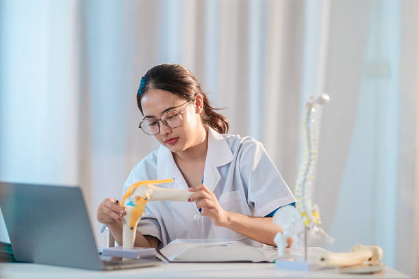 istock Asian Medical Student Studying Anatomical Model 2213636154
