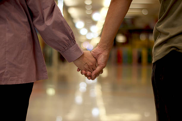 istock Heterosexual couple in holding hands. 2213644325