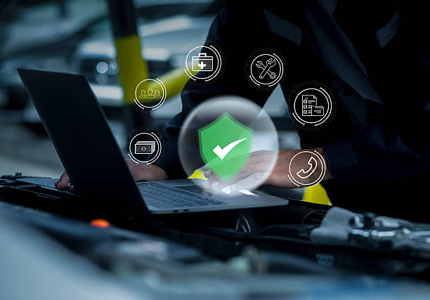 istock Man looking at details with technology about smart maintenance system inspection and maintenance in modern car garage. Car mechanic working with smart car maintenance software. 2213644442