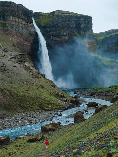 istock Woman looking at Haifoss  waterfall in Iceland 2213645190