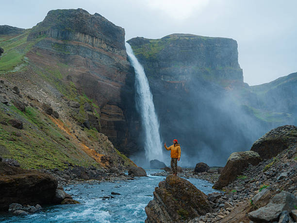 istock Man photographing Haifoss waterfall in Iceland 2213645216
