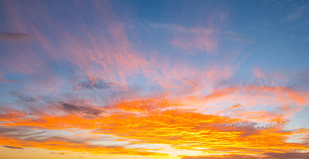 istock Sky at sunset. Sunrise over horizon. Sunset through clouds on sky. Twilight sky with sunset colors. Peaceful dawn with soft light. Dramatic dusk sunset with clouds. Sunshine in clear sky. 2213645421