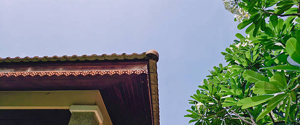 istock Floral patterned eaves, Decorative eaves old house roof, cloudless sky background 2213648845