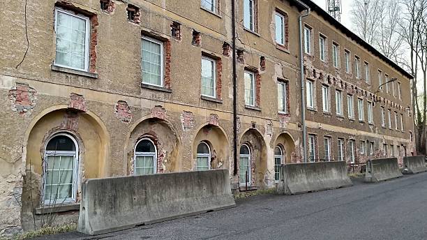 istock Abandoned Industrial Building in a Wealthy Urban Area with Diverse Architectural Features 2213649310
