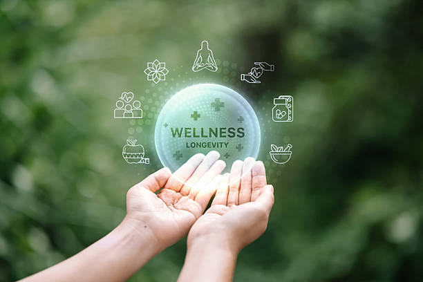 istock Wellness and longevity infographic over human hand with green blurred background. 2213655175