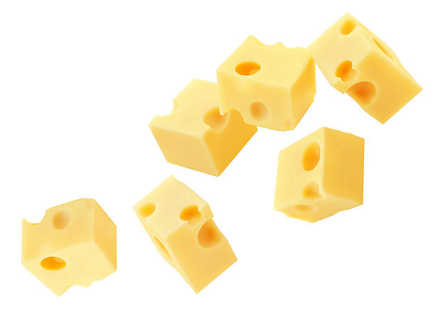 istock Cheese pieces isolated on white. Levitating maasdam cheese cubes. Holey Cheese Explosion. Top view. Flat lay.  Package design element.  Creative layout 2213658419